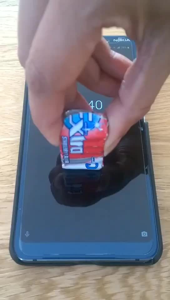 Video of the fingerprint sensor unlocking phone with a packet of chewing gum and someone else's finger