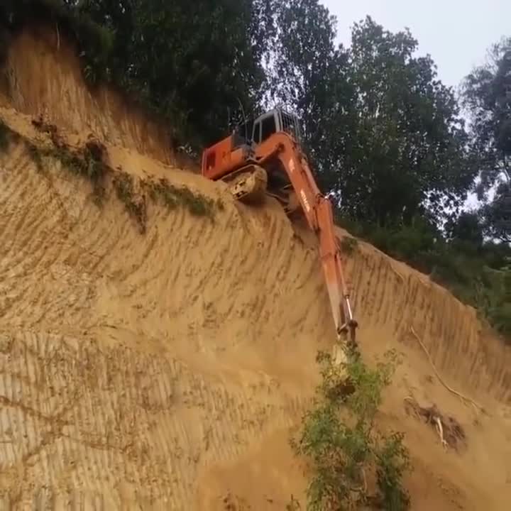 Epic Driving Backhoe go down from the Hill.